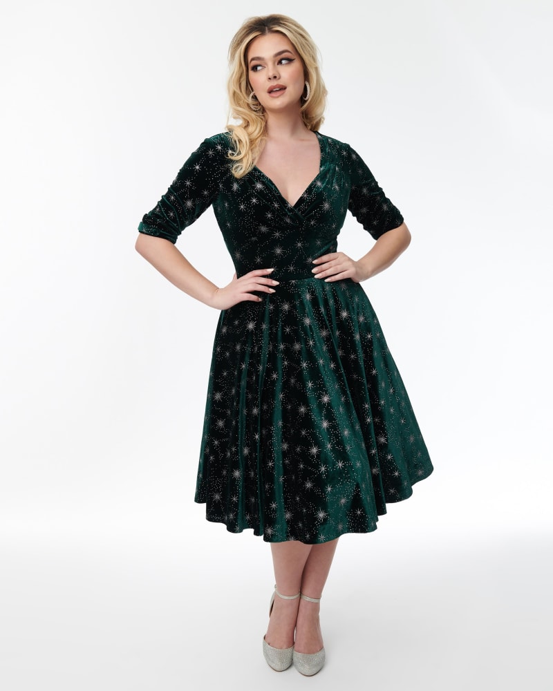 Front of a model wearing a size 2X Unique Vintage Emerald Velvet & Starburst Delores Swing Dress in Emerald Velvet & Starburst by Unique Vintage. | dia_product_style_image_id:320687
